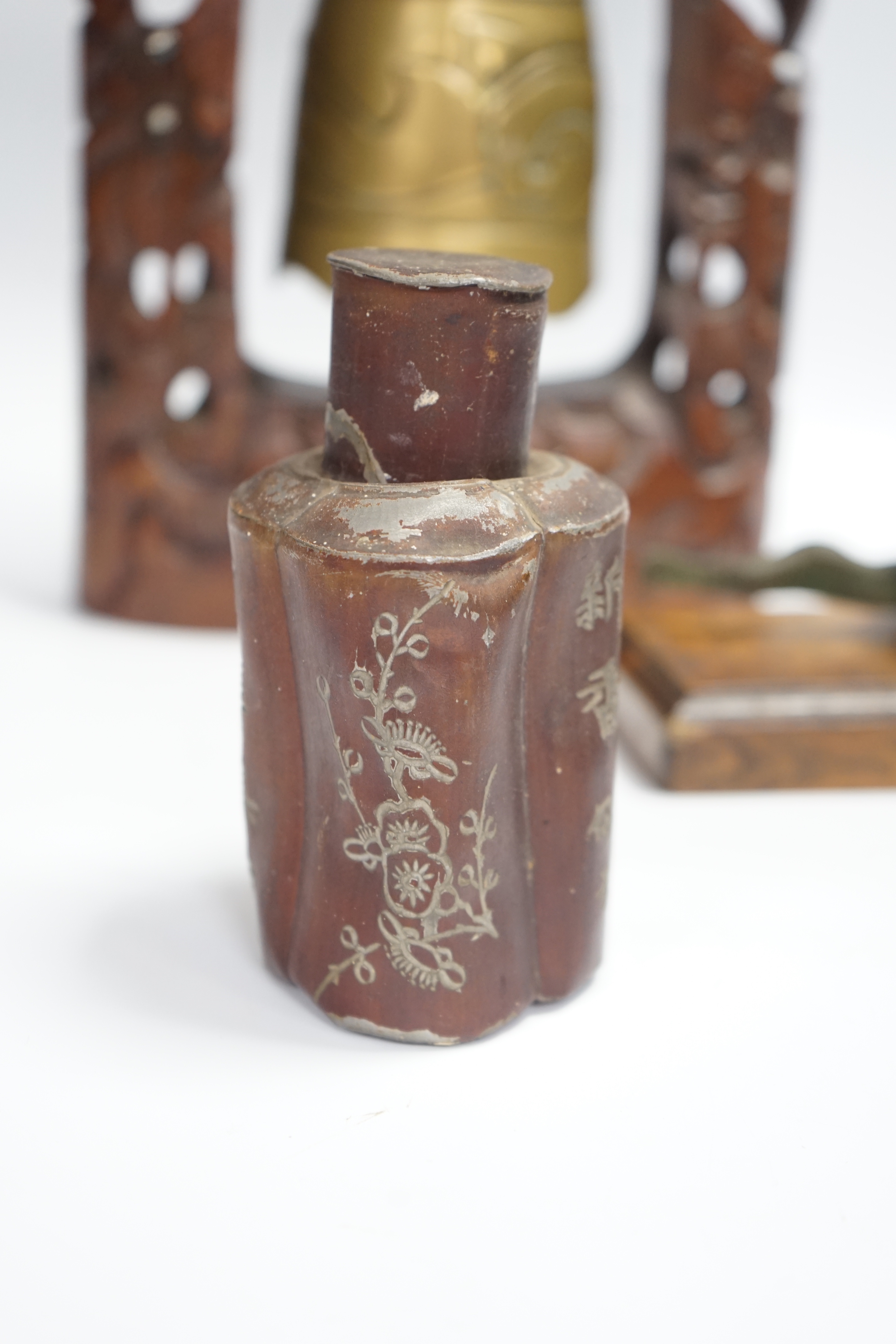 A Chinese table bell, pewter tea canister and an Indian ‘cobra’ hook, bell in frame 34.5cm high